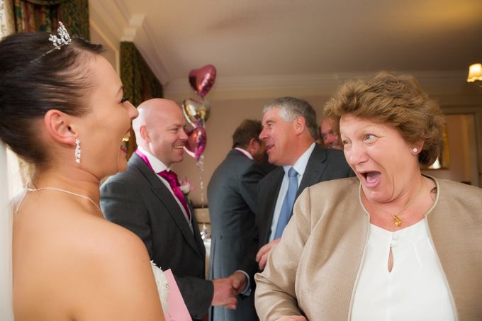 Wedding photography - having a laugh greeting the guests