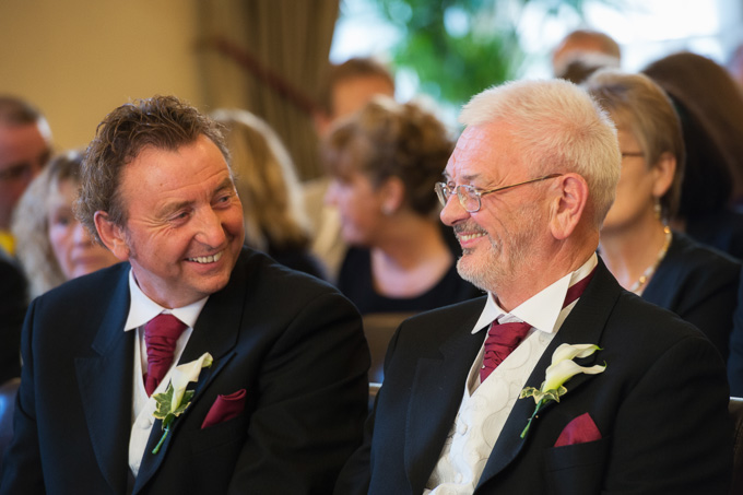 Wedding photograph of two happy fathers