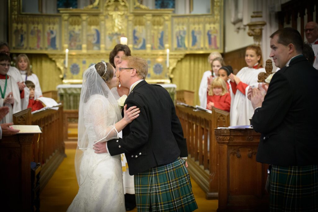 First kiss at Christ Church Harrogate wedding ceremony.