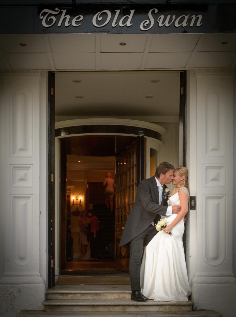 The Old Swan Entrance: "Wedding couple sharing a romantic moment in the doorway of The Old Swan Hotel, Harrogate."