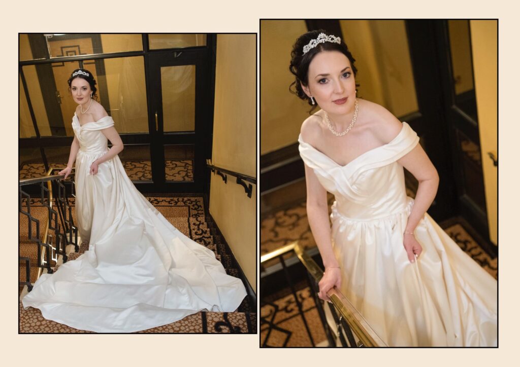Elegant bride in a satin off-the-shoulder wedding dress posing on the grand staircase at The Queens Hotel, Leeds.